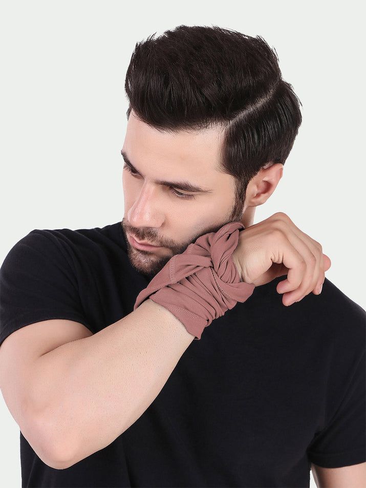 Freecultr arm sleeves for boys shown on a young person in outdoor sun protection use, breathable natural fiber fabric in light color