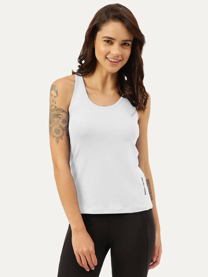 Freecultr white tank top womens in micro-modal bamboo blend shown as a layering piece on a neutral background, clean minimal styling
